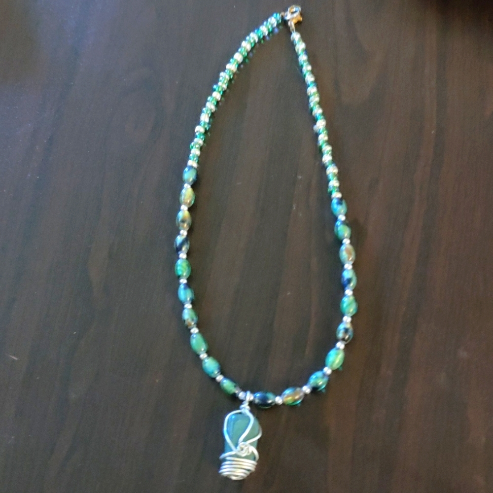 Glass beaded necklace with wire wrapped aventurine pendant